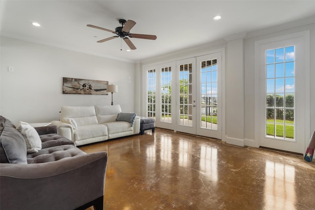 living room with crown molding, finished concrete flooring, baseboards, recessed lighting, and a ceiling fan