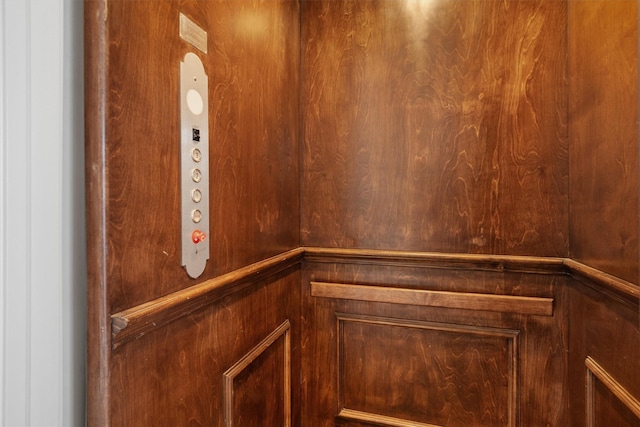 details with wood walls and elevator