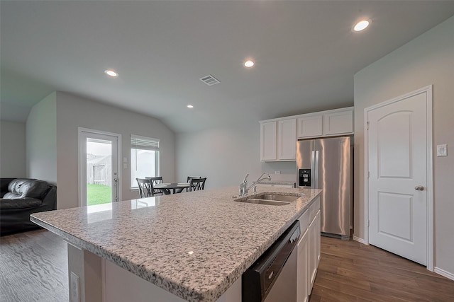 kitchen with visible vents, stainless steel fridge with ice dispenser, a sink, dark wood finished floors, and dishwasher