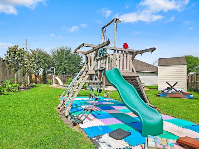 view of play area featuring a lawn and a fenced backyard