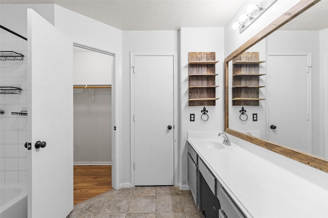 bathroom with vanity and baseboards