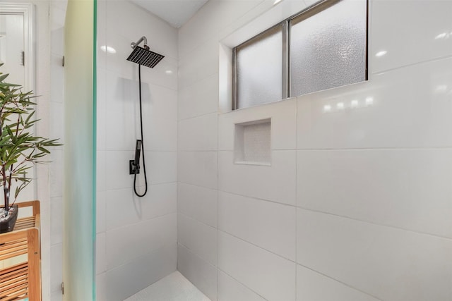 bathroom with tiled shower