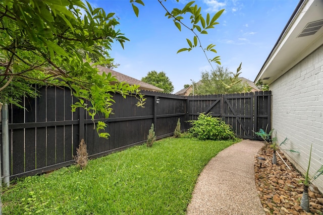 view of yard featuring a fenced backyard