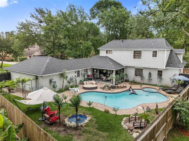 view of pool with a fenced in pool, a fenced backyard, an in ground hot tub, and a patio area
