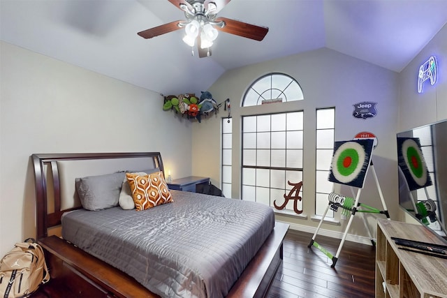 bedroom with ceiling fan, baseboards, lofted ceiling, and dark wood-type flooring