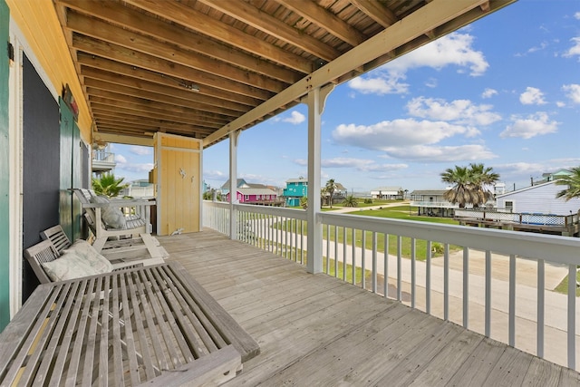 wooden deck featuring a residential view