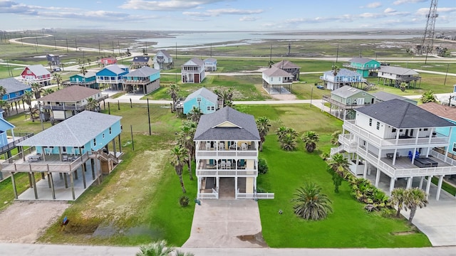 bird's eye view featuring a residential view and a water view