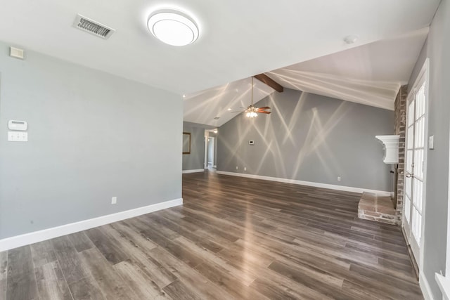 unfurnished living room featuring baseboards, vaulted ceiling, wood finished floors, and visible vents