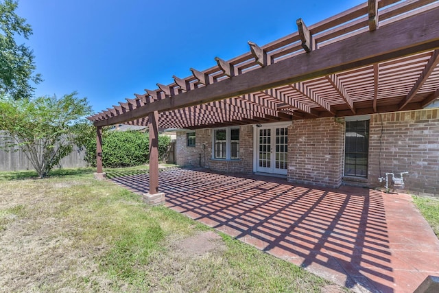 view of yard featuring a patio, french doors, fence, and a pergola