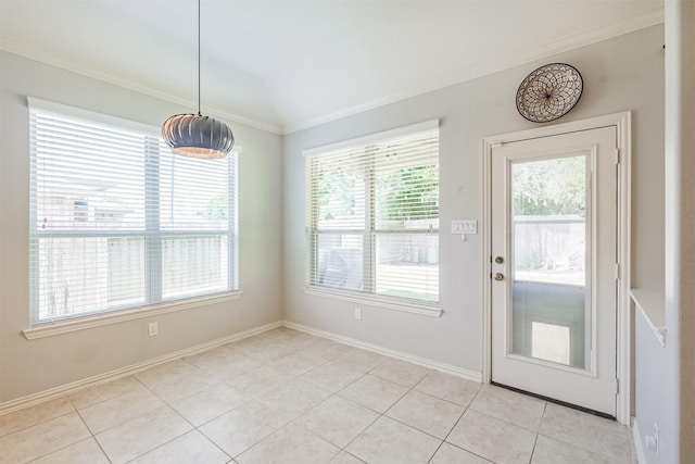 entryway with baseboards, ornamental molding, and light tile patterned floors