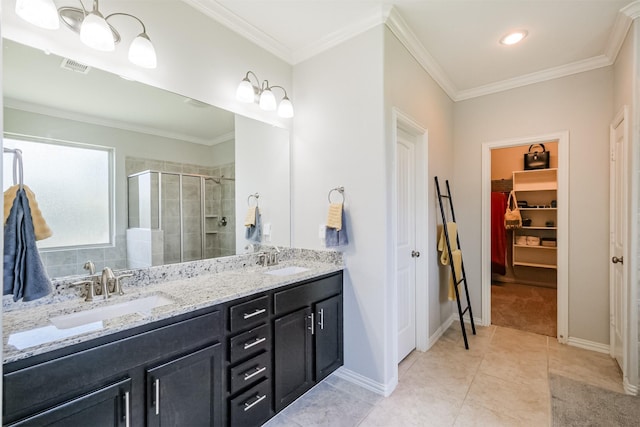 full bath with a sink, a walk in closet, a shower stall, and visible vents