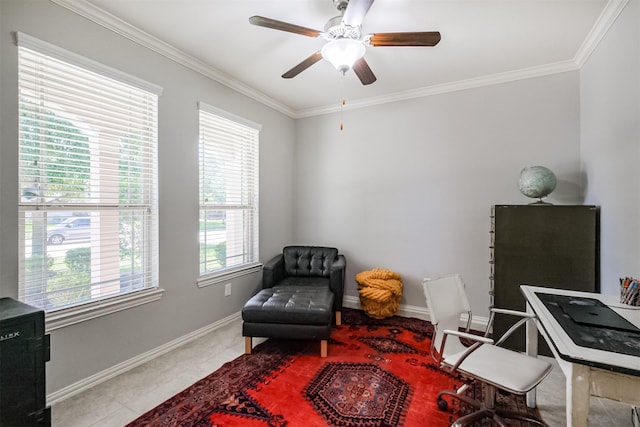 sitting room with crown molding, baseboards, and ceiling fan