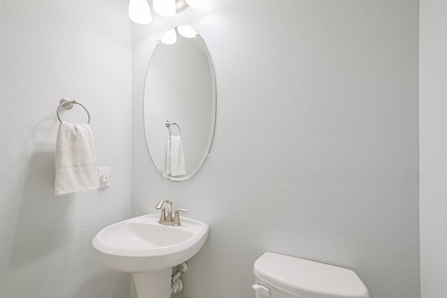 bathroom featuring a sink and toilet