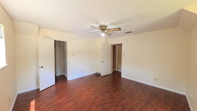 spare room with baseboards, ceiling fan, wood finished floors, and visible vents