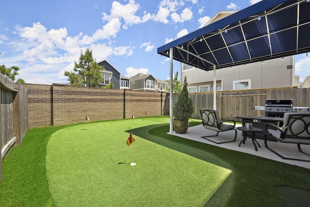 9904 Smokehouse Silo Ln, Houston, TX 77080 - fenced backyard with a putting green, a patio, and a residential view