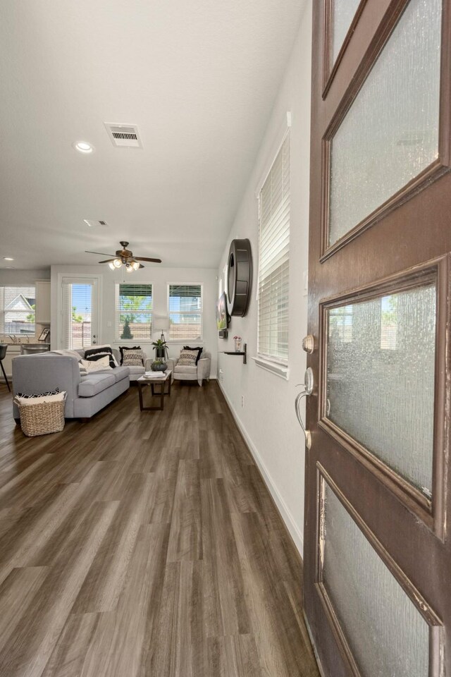 9904 Smokehouse Silo Ln, Houston, TX 77080 - foyer featuring wood finished floors, a ceiling fan, healthy amount of natural light, recessed lighting, and baseboards
