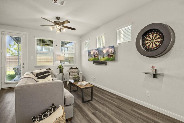 9904 Smokehouse Silo Ln, Houston, TX 77080 - sitting room featuring baseboards, plenty of natural light, a ceiling fan, and dark wood-style flooring