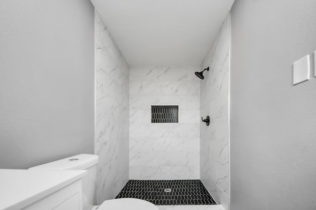 full bath featuring vanity, a stall shower, visible vents, and toilet