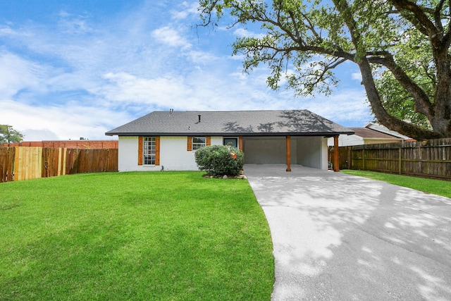 single story home featuring an attached carport, fence, concrete driveway, and a front lawn