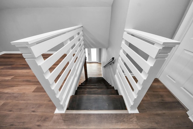 staircase with wood finished floors