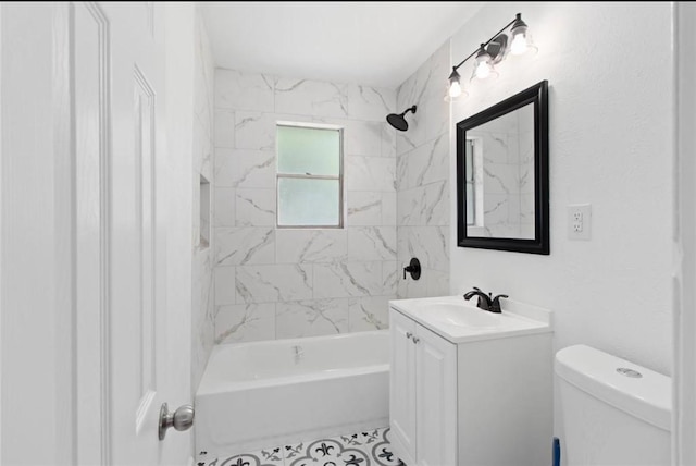 bathroom with vanity, tile patterned flooring, toilet, and shower / washtub combination