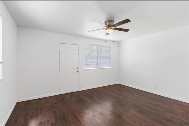 unfurnished room featuring baseboards, a ceiling fan, and wood finished floors