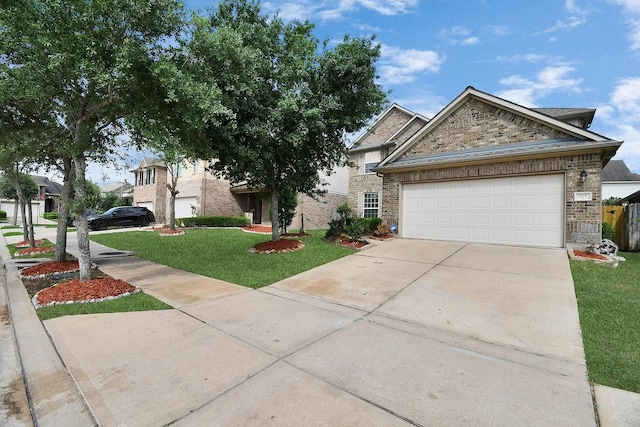 6315 Bain Dr, Missouri City, TX 77459 - view of front facade featuring brick siding, a garage, a front yard, and concrete driveway