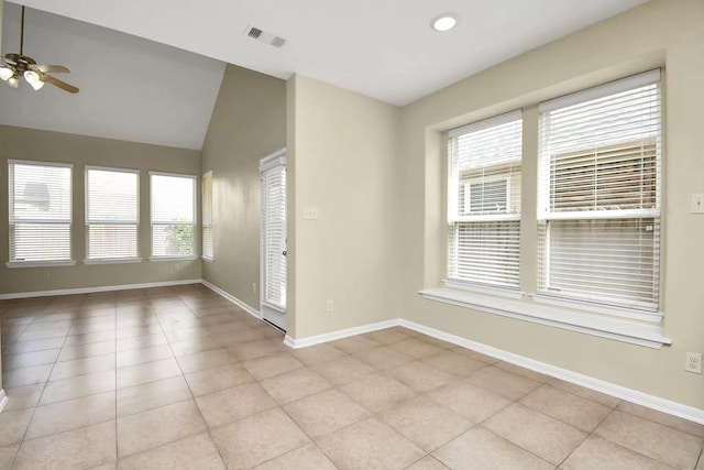6315 Bain Dr, Missouri City, TX 77459 - spare room with a ceiling fan, baseboards, light tile patterned floors, vaulted ceiling, and visible vents