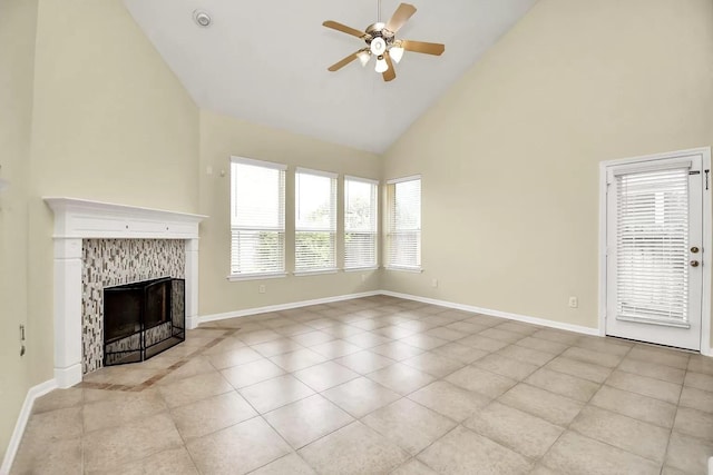6315 Bain Dr, Missouri City, TX 77459 - unfurnished living room featuring light tile patterned flooring, baseboards, high vaulted ceiling, a tiled fireplace, and a ceiling fan