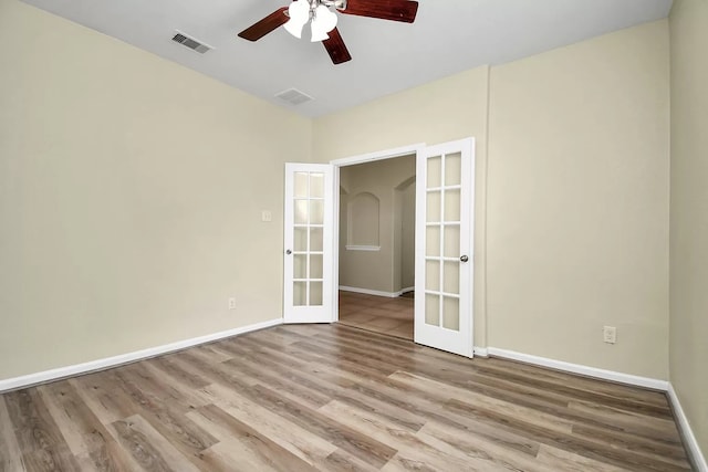 6315 Bain Dr, Missouri City, TX 77459 - spare room with french doors, a ceiling fan, baseboards, wood finished floors, and visible vents