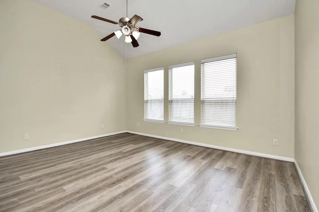 6315 Bain Dr, Missouri City, TX 77459 - spare room with ceiling fan, visible vents, vaulted ceiling, wood finished floors, and baseboards