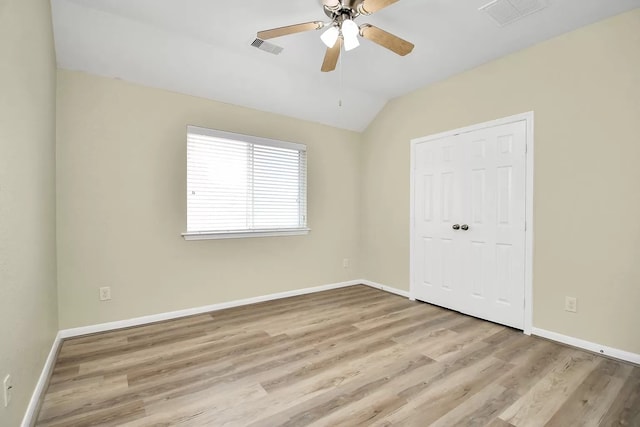 6315 Bain Dr, Missouri City, TX 77459 - unfurnished bedroom featuring visible vents, wood finished floors, and lofted ceiling