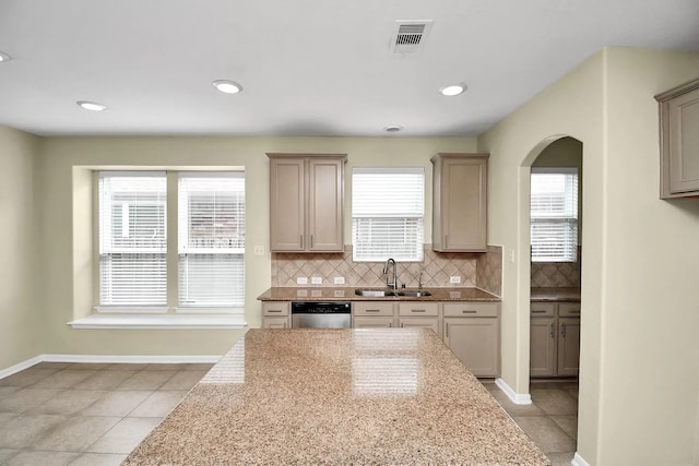 6315 Bain Dr, Missouri City, TX 77459 - kitchen featuring a sink, light tile patterned floors, a wealth of natural light, and dishwasher