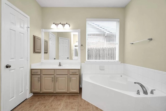 6315 Bain Dr, Missouri City, TX 77459 - bathroom with vanity, tile patterned floors, and a bath