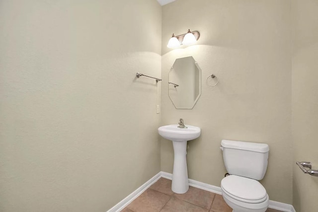 6315 Bain Dr, Missouri City, TX 77459 - half bath featuring tile patterned floors, baseboards, and toilet