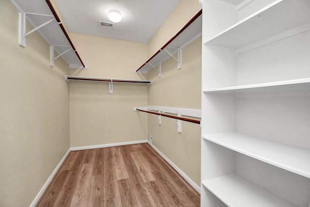 6315 Bain Dr, Missouri City, TX 77459 - walk in closet with visible vents and wood finished floors