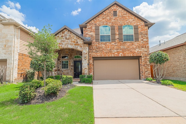 view of front of house with an attached garage, a front lawn, driveway, and brick siding