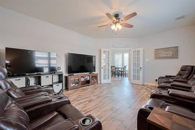 26210 Seminole Hill Ln, Katy, TX 77494 - living room featuring french doors, ceiling fan, light wood finished floors, and baseboards