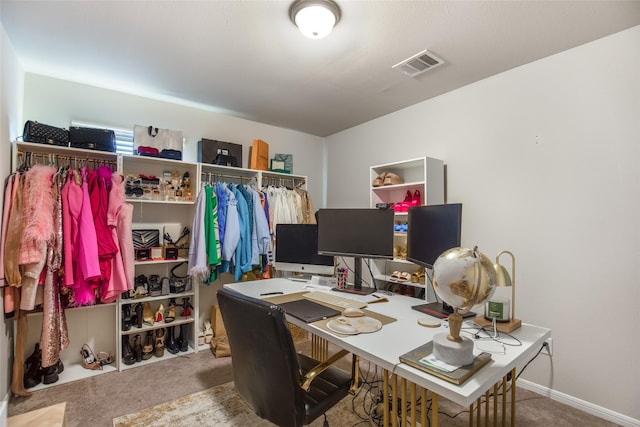 office space featuring visible vents and carpet flooring