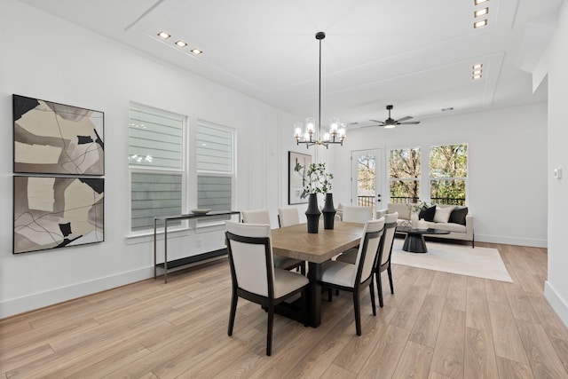 dining space with recessed lighting, baseboards, light wood-style flooring, and ceiling fan with notable chandelier