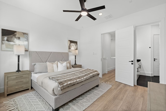 bedroom with visible vents, baseboards, ceiling fan, and wood finished floors