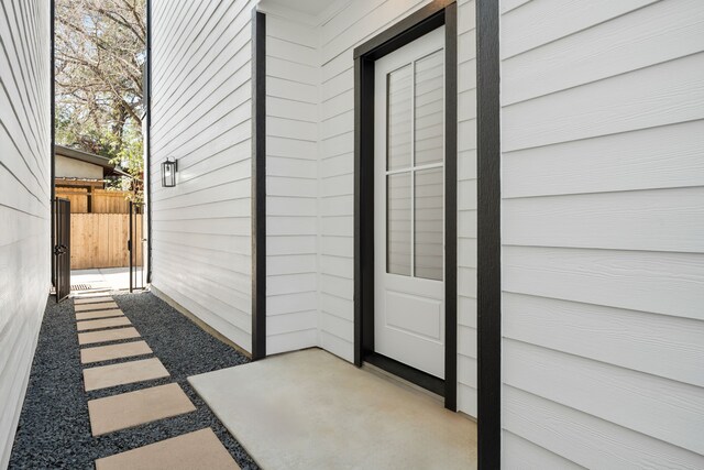 property entrance with fence