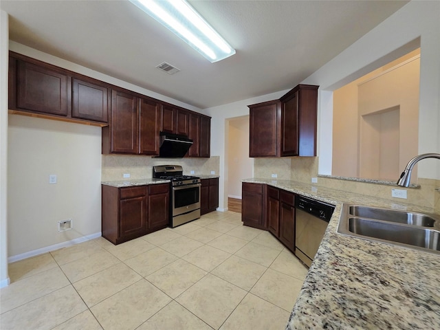 kitchen featuring a sink, stainless steel appliances, light tile patterned floors, tasteful backsplash, and visible vents