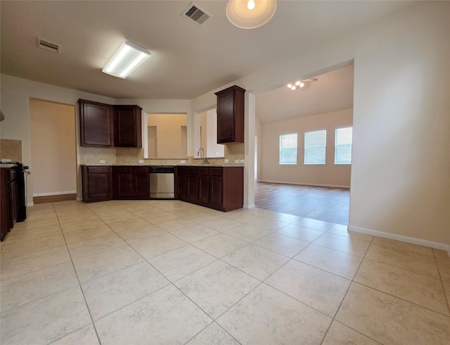kitchen featuring visible vents, light tile patterned flooring, dark brown cabinets, and stainless steel dishwasher