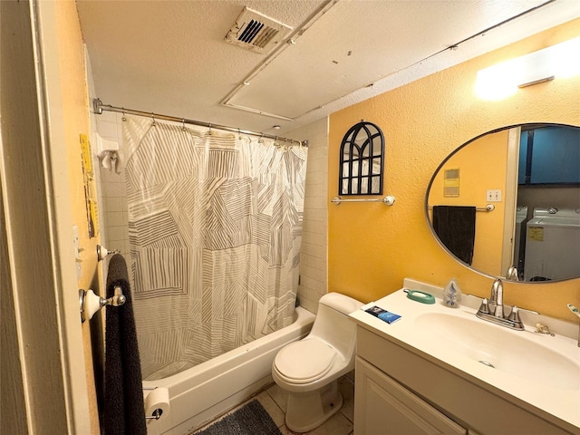 full bath with visible vents, vanity, a textured wall, toilet, and washing machine and clothes dryer