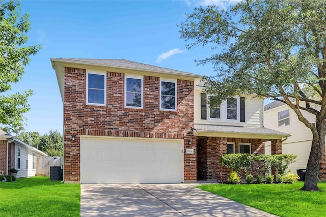 15334 Forest Creek Farms Dr, Cypress, TX 77429 - view of front of property featuring a garage, driveway, a front yard, brick siding, and central AC