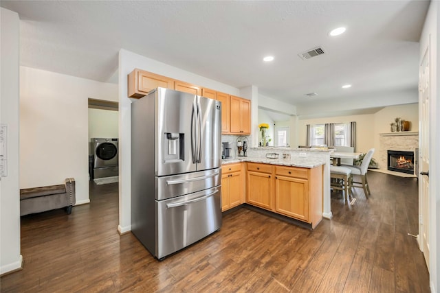 15334 Forest Creek Farms Dr, Cypress, TX 77429 - kitchen with stainless steel fridge, a peninsula, dark wood-style flooring, a fireplace with flush hearth, and recessed lighting