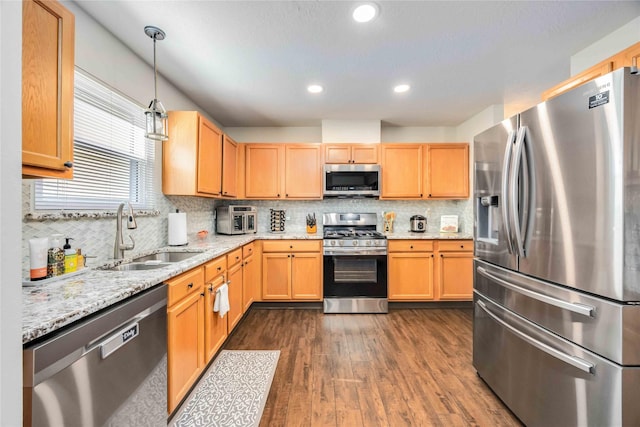 15334 Forest Creek Farms Dr, Cypress, TX 77429 - kitchen featuring appliances with stainless steel finishes, a sink, dark wood finished floors, backsplash, and recessed lighting