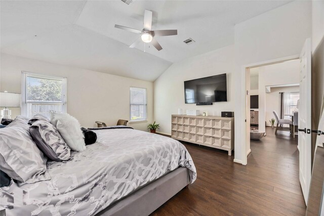 15334 Forest Creek Farms Dr, Cypress, TX 77429 - bedroom with dark wood-style flooring, lofted ceiling, and a ceiling fan