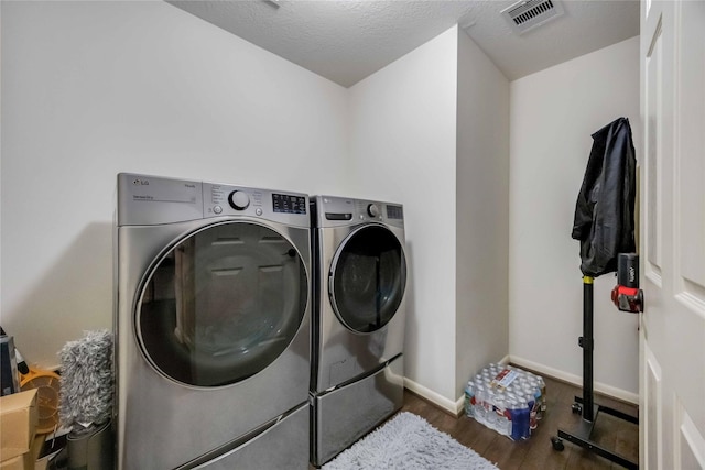 15334 Forest Creek Farms Dr, Cypress, TX 77429 - laundry room with washing machine and clothes dryer and wood finished floors